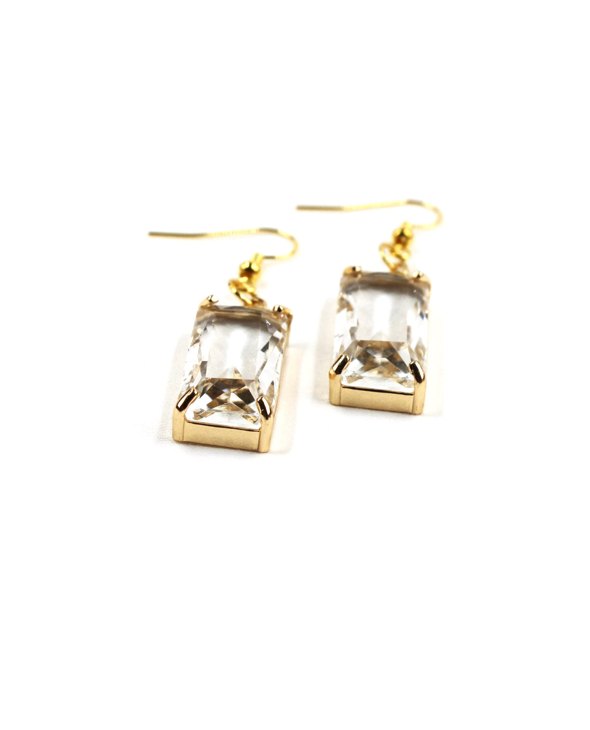 Pendientes Lumière dorados con cristal rectangular transparente