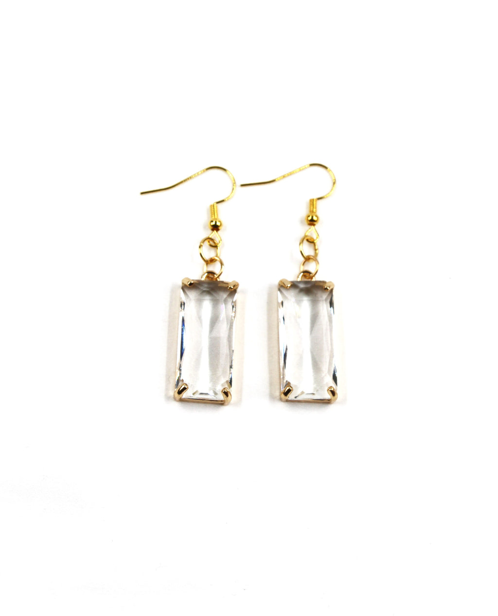 Vista frontal de Pendientes Lumière dorados con cristal transparente